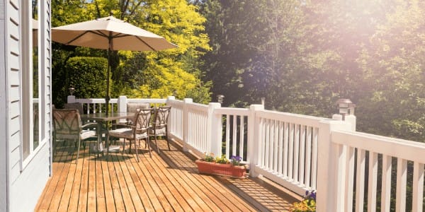 Exterior deck remodel with white railings. Spears Design Build Group.