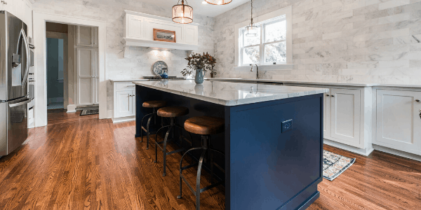 Kitchen island with bold blue cabinets.