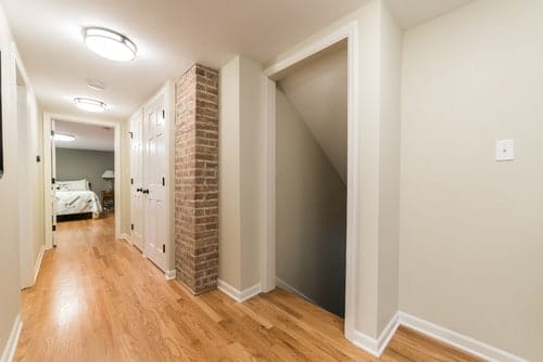 Interior view of second story addition featuring bedroom and hallway design. Spears Design Build Group.