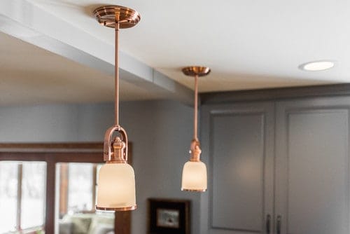 Copper pendant lighting in an elegant North Aurora, IL kitchen remodel. Spears Design Build Group.