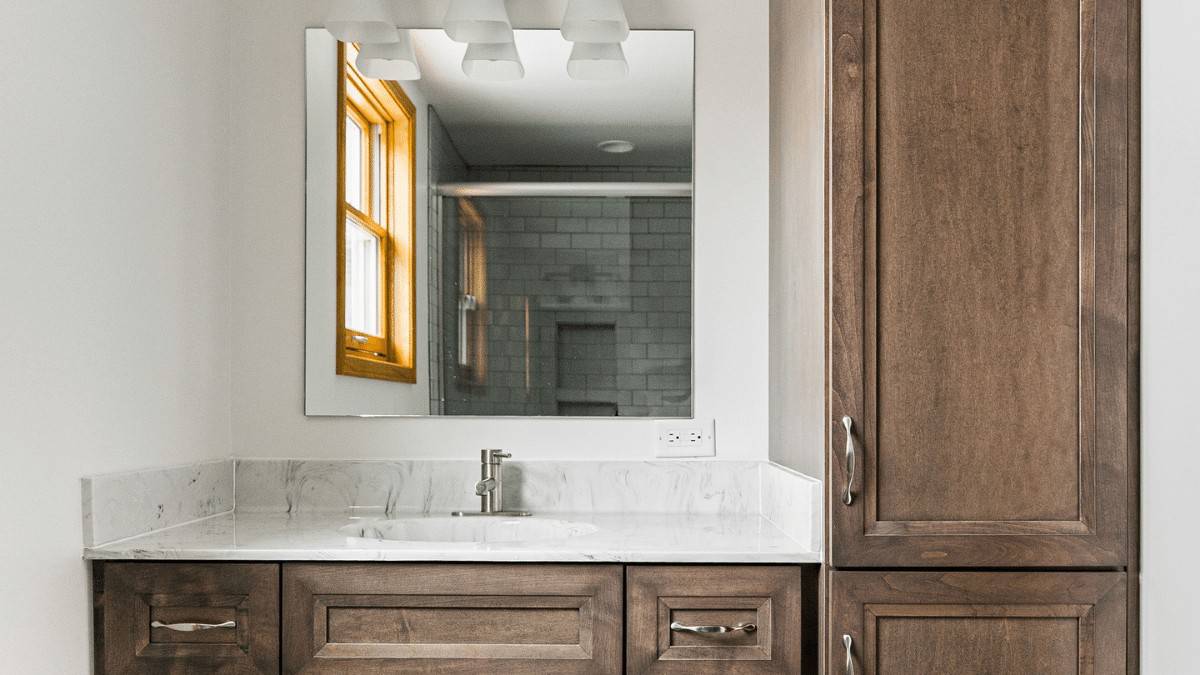 bathroom remodel with brown cabinets