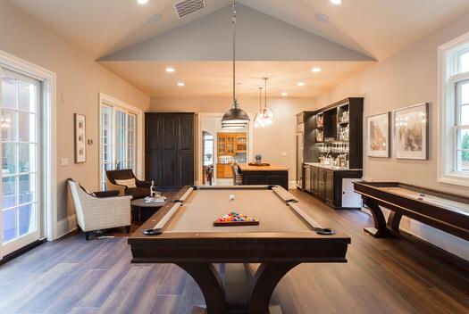 man cave with pool table and shuffle board