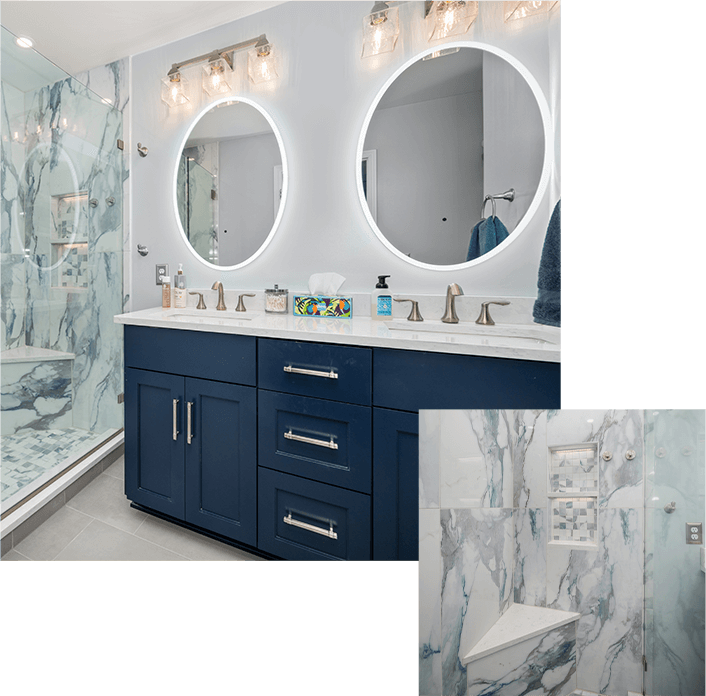 Bathroom remodel with a dual vanity of blue cabinets, round mirrors, and a blue-and-white marbled walk-in shower.
